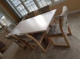Sturdy dining set seats six; Corian top; table folds down