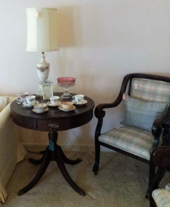 drum table, cups/saucer collection, lamp, upholstery chair