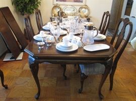 Back when furniture was made with WOOD,  this timeless dining room set is an ALBRIGHT & ZIMMERMAN design. Includes table, 2 leaves (total length 8' when inserted), 6 chairs and table pads.  Well constructed with metal clasp securing leaves. 