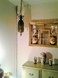 Back corner view of Formal Living Room featuring  lovely unusual 1950's green crackled glass "Swag-Chain" ceiling lamp, hanging display  "Shadow-Box," and chartreuse green double-door cabinet.