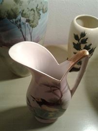 Gorgeous design of top with its beautiful gold handle.