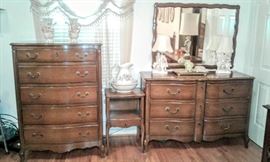 Lovely "Drexel" French Provincial Bedroom Suite. This suite is in mint condition. This set includes; Dresser,  Chest of Drawers, 1 Night Stand, Queen-Size Headboard and Footboard.