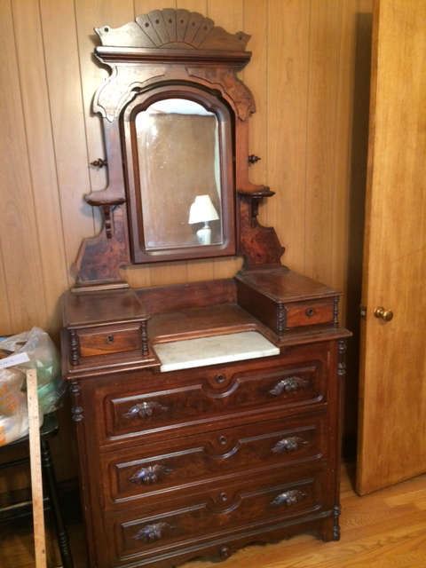 Antique mahogany dresser with marble inlay. All original with mirror and pulls.