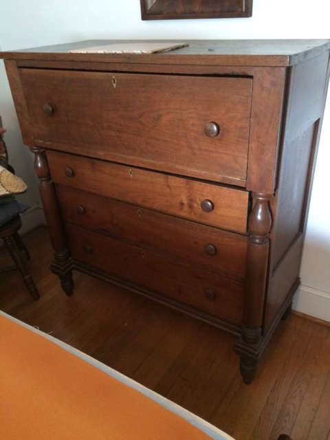 Large 4-1/2 ft. four-drawer chest c/1800. Walnut planks and original knob pulls