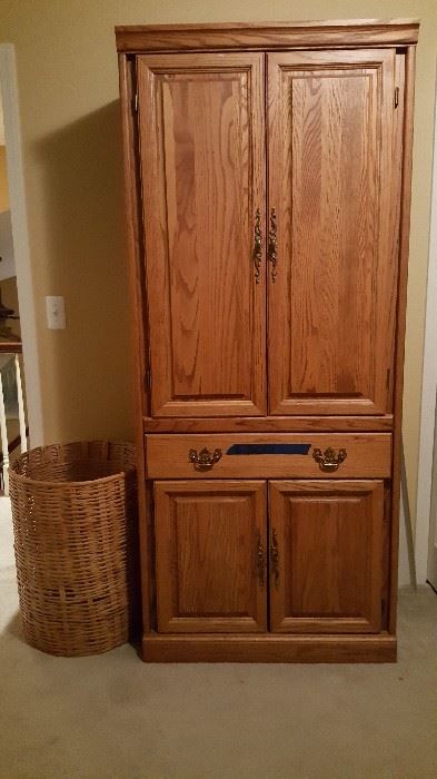 Solid wood cabinet w/shelves. Wicker hamper.
