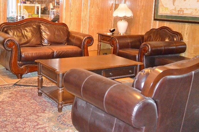 Beautiful leather living room set.  Sofa, love seat, chair and ottoman.  2 end tables, coffee table, small console table