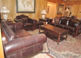 Beautiful leather living room set. Sofa, love seat, chair and ottoman. 2 end tables, coffee table, small console table