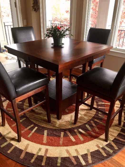 40” tall bistro style table with 4 swivel barstools (these match the other 4 that are priced separately)