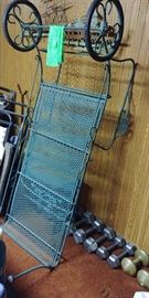 Dark green outdoor chaise lounger on wheels