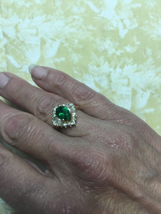 10K Gold Beautiful Emerald Ring Surrounded by CZ