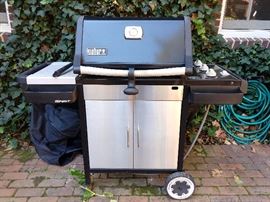 Nice Weber gas grill, with cover included.