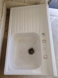 Fun! A vintage enamel sink, with built-in drainboard - great for a mountain house or potting shed.