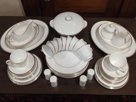 Simple & Elegant, two of my favorite things in life!       This 64-piece set of Royal Doulton (England) "Alice" china is a set of 10, including serving pieces:                      -10 dinner plates                                                                                  
-10 dessert plates                                                                                -10 bread plates                                                                                   -10 saucers                                                                                              -10 coffee cups                                                                                         -2 large serving platters + gravy boat/underplate                                                                    -2 vegetable bowls + 2 pair salt/peppers                                                                                 -1 lidded casserole dish + cream/sugar                                     