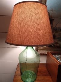 Yee Haw! A green glass bottle jes like the ones moonshiners used to have. Grab this lamp and begin putting all of your spare pennies in it, for your child's education.