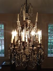 Breaking news! We were given the green light today to sell most of the lighting fixtures in the house, as the new owners envision a different look. SO, this European chandelier is now available. It is obviously electrified, but it also has candleholders, for particularly romantic dinners.
Actually, this is how the famous rock band, AC/DC, got its name, from versatile European chandeliers... Umm hmm, you know it's true! This piece has eight lights and nine candles, measures 3' T x 21" W.