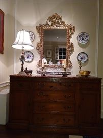 SO, the yew wood buffet has gotten a make-over, It's still the same fabby piece of furniture, but it now has an equally fabby gilded wood mirror, Asian porcelain lamp, with bronze mounts and birds, silverplated gallery tray with all kinds of sparkly cut glass and the English porcelain plate collection has been more tastefully re-hung. You're welcome.