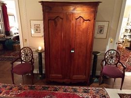 The antique French armoire measures 7' 7" T x 2' D x 4' 2" W.