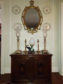 This won't last long. A very nice antique, gilt wood mirror with all the hangy things that we want and adore, no matter the price or heartbreak; measures 26" W x 44" T. The vintage mahogany chest has two doors that open to reveal three drawers - very cool piece. A set of four vintage English porcelain plates flank the mirror.