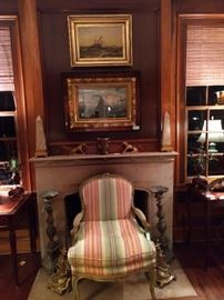 Vintage original oil paintings of ships, French bergere armchair and pair of antique prickets. Hey, I'm old but no pricket!