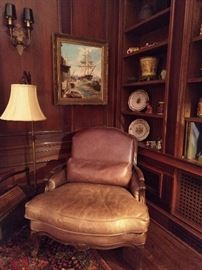 HERE is where you sit right down and nestle into a good book! Great leather armchair, with lumbar pillow. Nice, original oil painting of a ship, in a chippy ol' frame - it's jes rite!