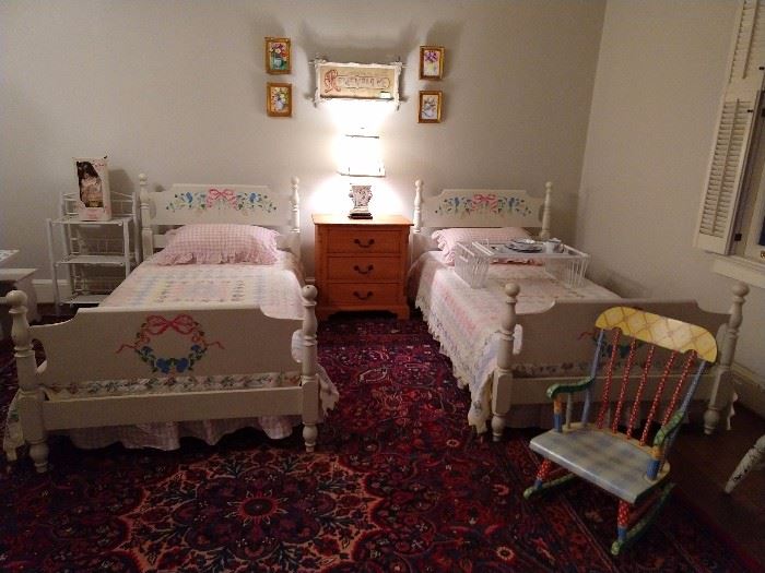 The upstairs children's bedroom, with vintage mahogany, yes mahogany twin beds. They were hand painted 25 years ago to be more girly - they succeeded. Each bed has a hand sewn quilt.