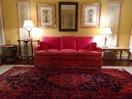 A quiet and restful upstairs sitting room, with hand painted door panels, red damask couch, Italian Florentine coffee table, pair of 4-light table lamps, large glazed ceramic urn, pair of nicely framed and matted architectural prints and a decent mirror. 