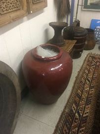 One of several glazed storage pots, handled baskets, and grain transporting vessels.  Upper edge left side shows a pair of hand carved Chinese screens.