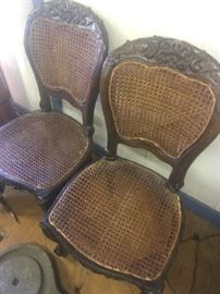 Two of four side chairs from the late 19th century with cane seats and backs in very good condition.