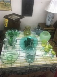 Table of early 20th century colored glasseware.