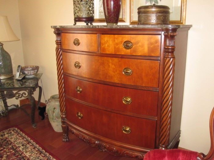 Beautiful curved front dresser with scroll work and carvings with marble top. $400