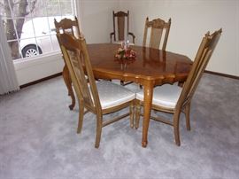 Dining room table and 6 chairs(two armed)