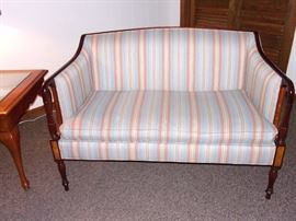 Settee, glass top end table and lamp