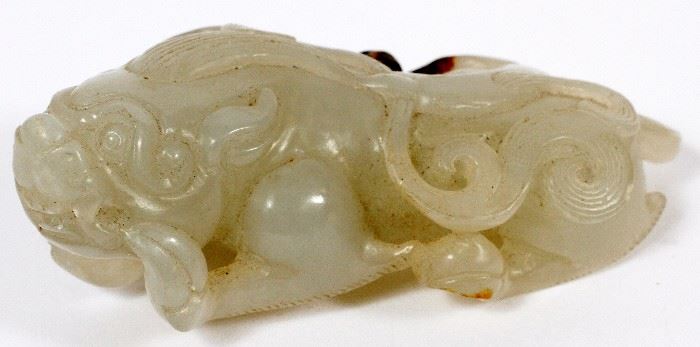 2324 - CHINESE CARVED GREEN JADE FOO LION, H 3 1/2" W 1 1/2"