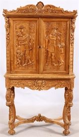 1042 - RENAISSANCE REVIVAL STYLE CARVED WALNUT CABINET, H 67", W 36"