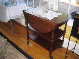 Antique cherry tea cart $325