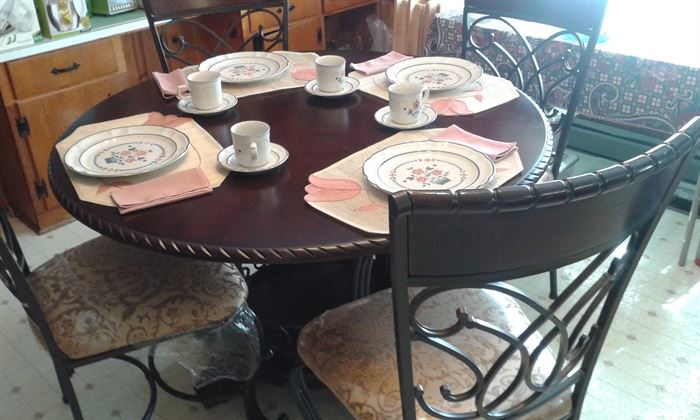 Table w/ 4 chairs...Wood, Wrought iron and padded seats
