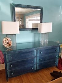 Blue dresser with matching mirror. Pair of glass lamps