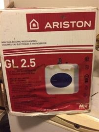 New in box mini tank electric water heater.