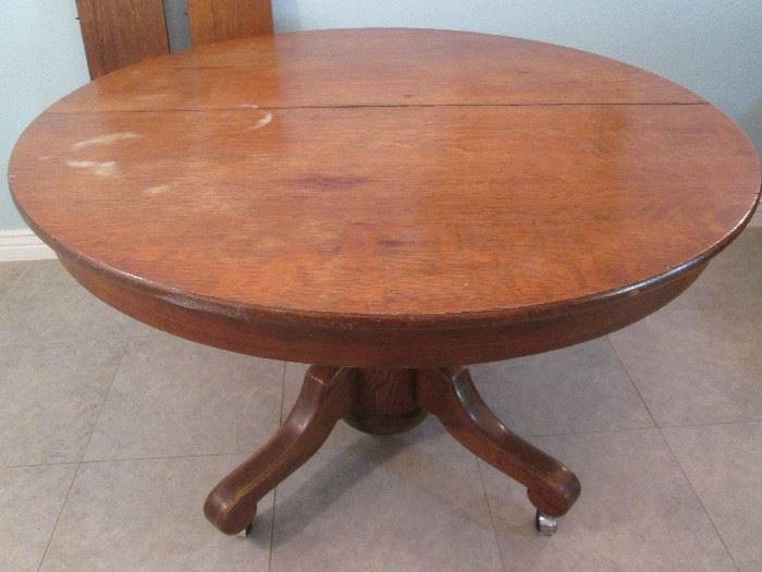 48" Pedestal Table with 2-9" leaves, on casters