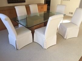 12. Glass Topped Dining Table w/ Two Oak Wood Bases (40" x 78" x 30")                                                               13. 6 Parsons Dining Chairs Covered in Cream Canvas (20" x 24" x 41")