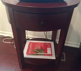 65. Oval Cherry Side Table w/ 1 Drawer and 1 Shelf (24" x 21" x 28")