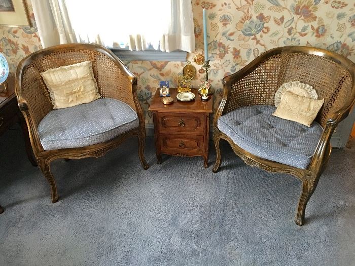 Cane back barrel chairs and table.