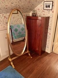 Oval standing mirror.  Pine cupboard