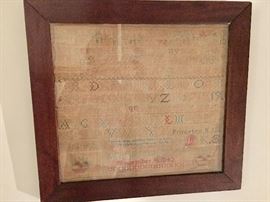 Hand wrought sampler, framed
