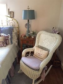 Brass bed (full size)  Wicker chair and oak nightstand.  Vintage early american blue lamp.