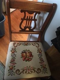 ONE OF A SET OF FOUR NEEDLEPOINT LYREBACK CHAIRS