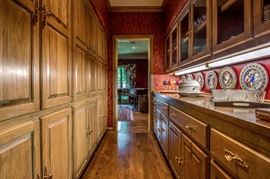 View through the Butler's Pantry to the dining room.  All these cupboards and drawers are full of fine items.