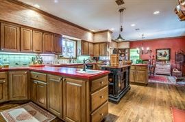 The kitchen is very large with lots and lots of cabinets ready to reveal their contents.  We have taken off 48 cabinet doors to use the cabinets as well as the countertops for display space.  