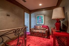 Cozy upstairs sitting area (the red lacquer table has gone to the daughter's)  Nice loveseat and art by Lubbock artist Bernice Fix