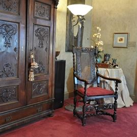 Large antique carved armoire flanked by Macintosh speaker houses a custom interior and vintage stereo equipment  (CHAIR WITHDRAWN BY FAMILY)